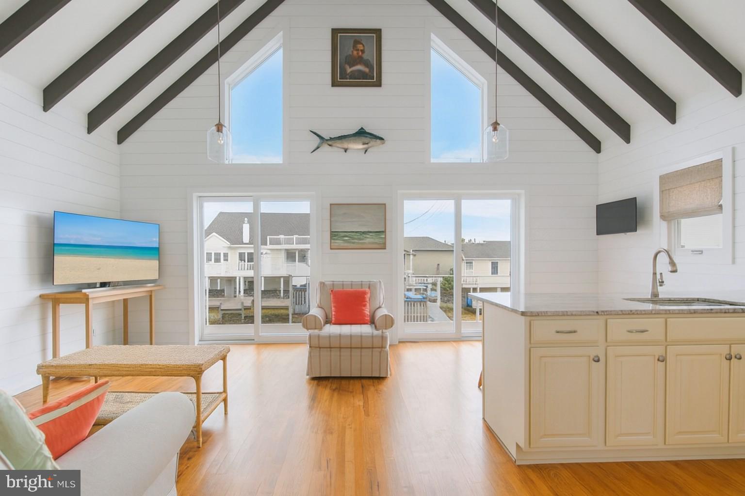 10602 Pine Needle Road Ocean City, MD 21842 - Photo 36 of 36 a living room with furniture and a kitchen view