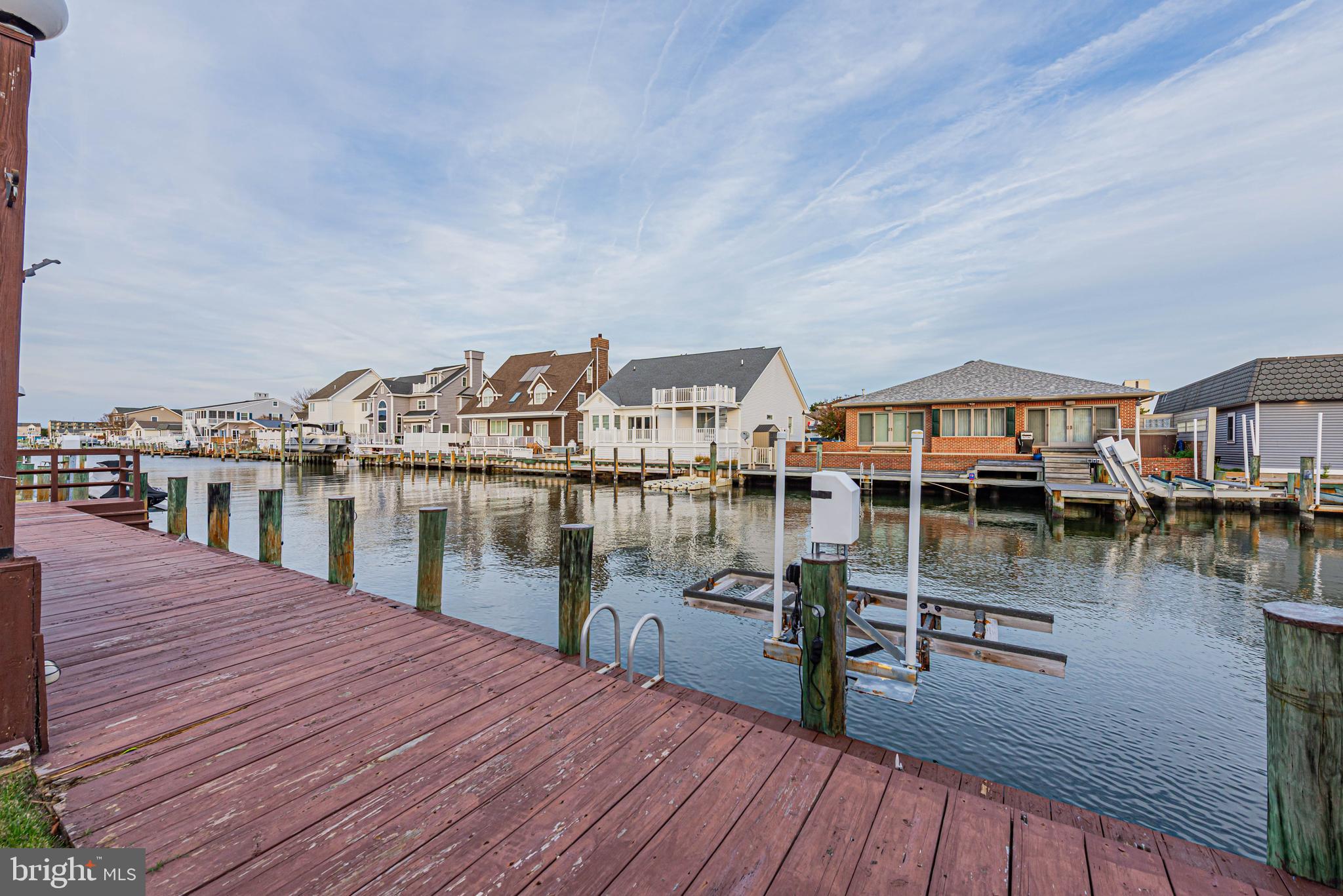 10602 Pine Needle Road Ocean City, MD 21842 - Photo 5 of 36 a balcony with wooden floors and lake view