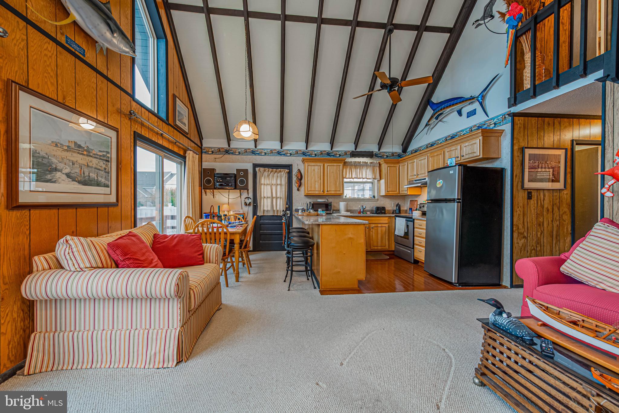 10602 Pine Needle Road Ocean City, MD 21842 - Photo 8 of 36 a living room with furniture and a flat screen tv