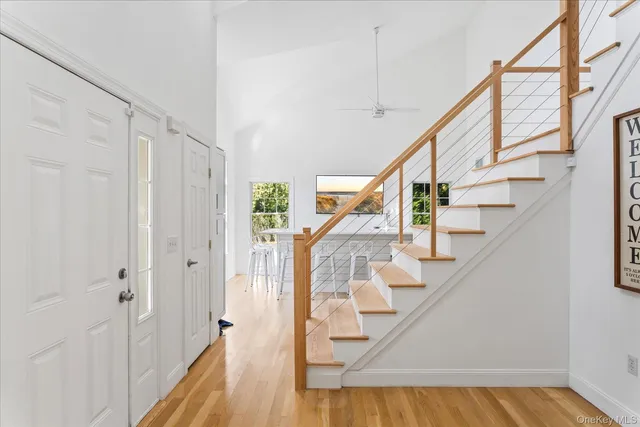 a view of entryway with wooden floor and stairs
