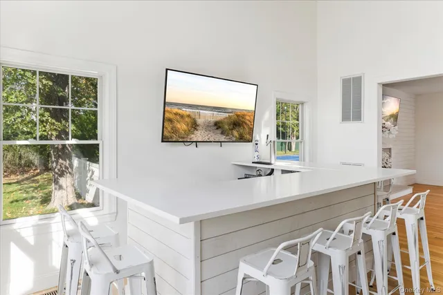 a view of a living room and a large window
