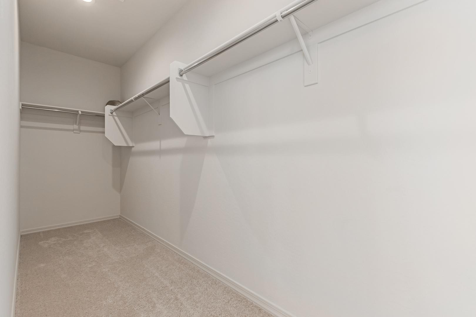 7143 West Coles Road Laveen, AZ 85339 - Photo 8 of 15 a view of a room with racks on the wall