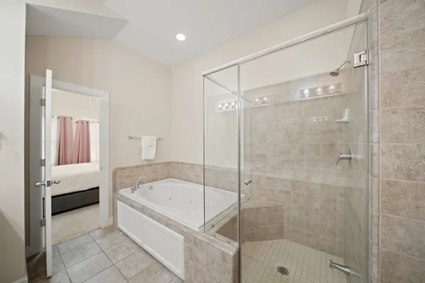 a bathroom with a bathtub and a shower