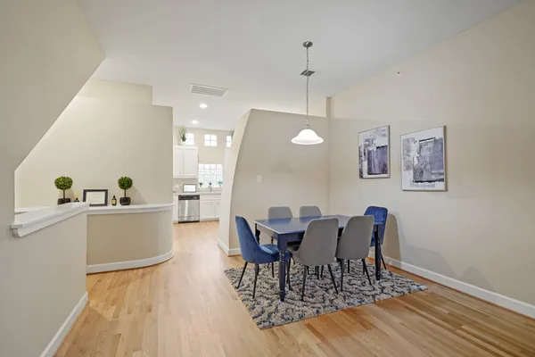 a view of a dining room with furniture and wooden floor