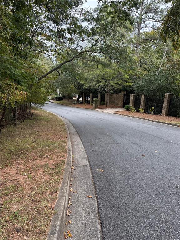 8290 Jett Ferry Road Atlanta, GA 30350 - Photo 14 of 16 a view of a street with trees