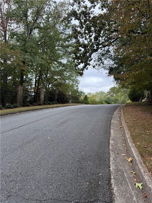8290 Jett Ferry Road Atlanta, GA 30350 - Photo 15 of 16 a view of a field with trees in background