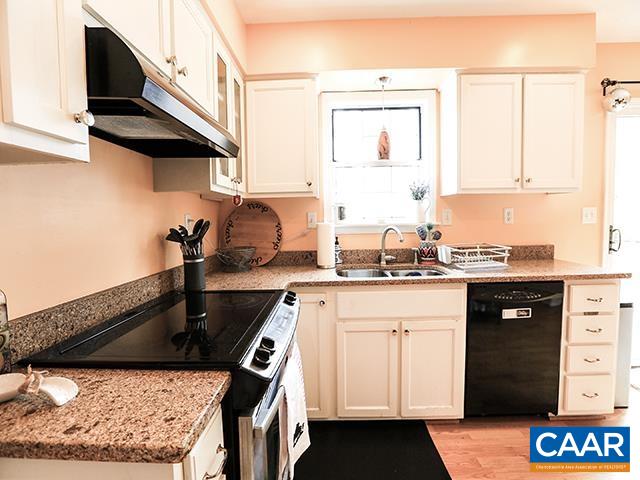 150 Olton Place Charlottesville, VA 22902 - Photo 16 of 40 a kitchen with a sink a stove and a cabinet