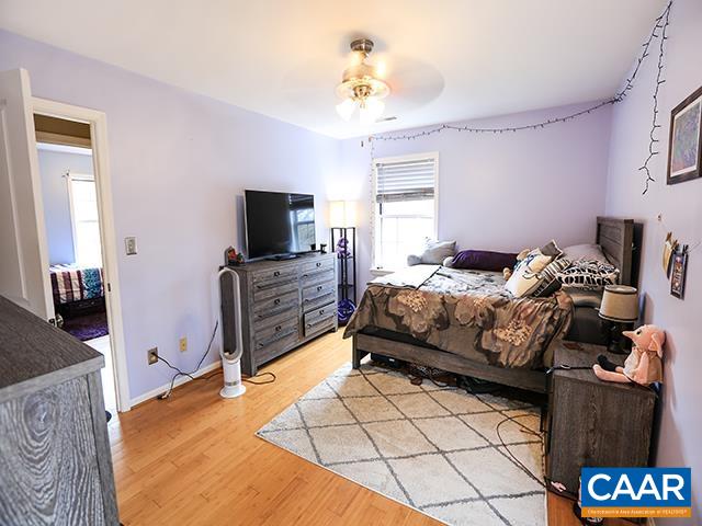 150 Olton Place Charlottesville, VA 22902 - Photo 23 of 40 a bedroom with a bed and a television