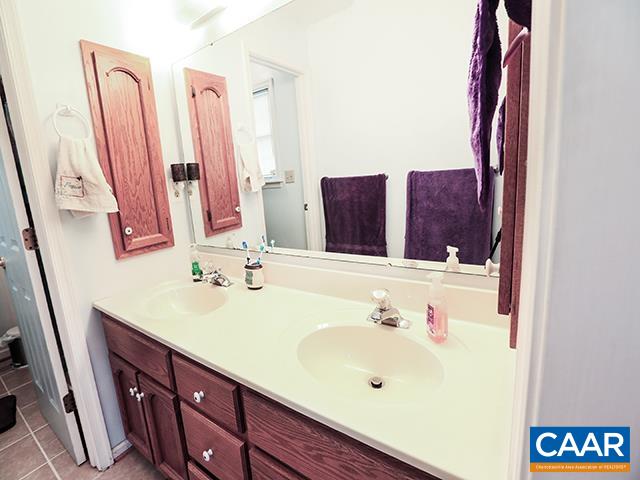 150 Olton Place Charlottesville, VA 22902 - Photo 25 of 40 a bathroom with a sink and a mirror