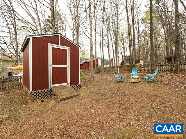 150 Olton Place Charlottesville, VA 22902 - Photo 32 of 40 a backyard of a house with oven and wooden fence