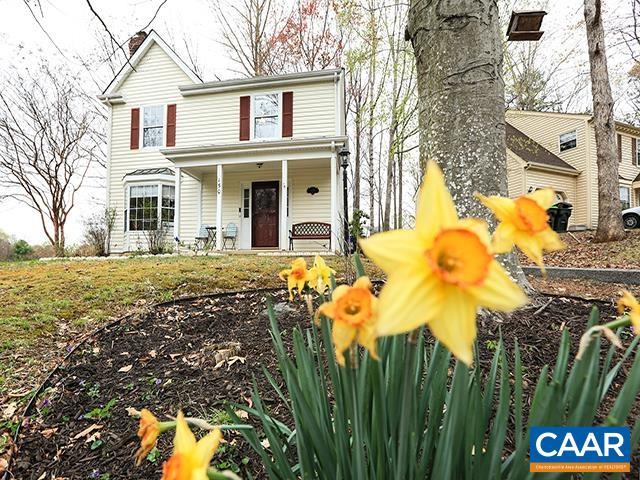 150 Olton Place Charlottesville, VA 22902 - Photo 4 of 40 a front view of a house with a yard and garage