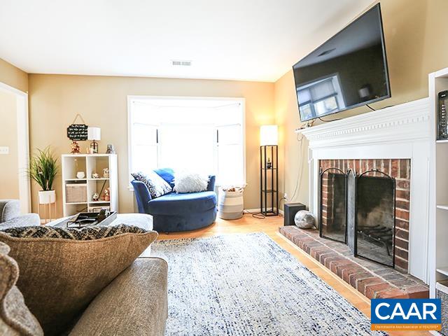 150 Olton Place Charlottesville, VA 22902 - Photo 7 of 40 a living room with furniture and a fireplace