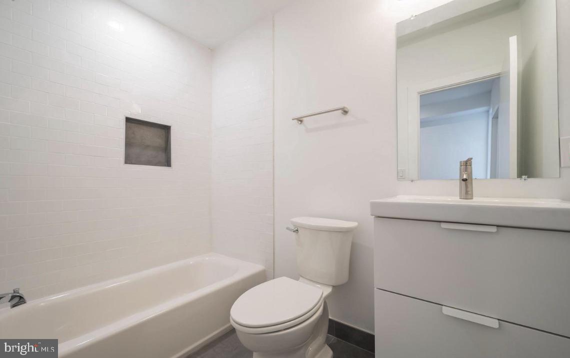 727 North 39th Street, Unit 2 Philadelphia, PA 19104 - Photo 14 of 15 a bathroom with a toilet a sink and a bathtub
