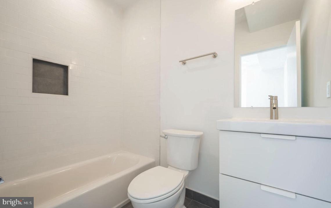 727 North 39th Street, Unit 2 Philadelphia, PA 19104 - Photo 15 of 15 a bathroom with a toilet a sink and a bathtub