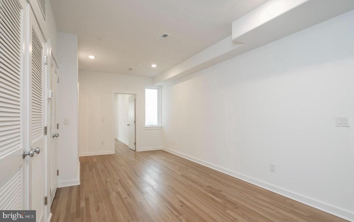 727 North 39th Street, Unit 2 Philadelphia, PA 19104 - Photo 4 of 15 a view of a room with wooden floor and window