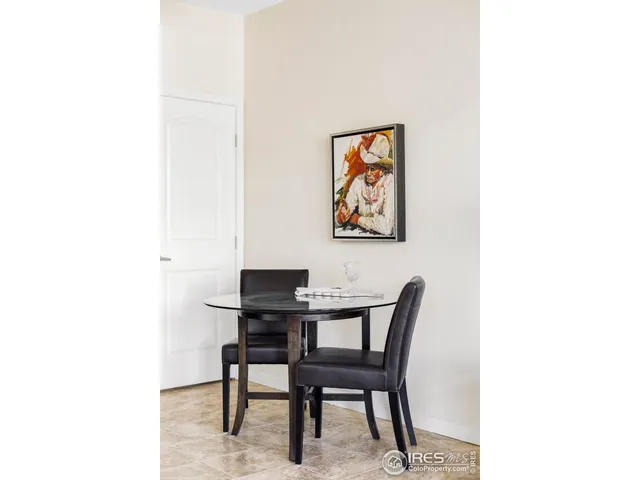 a living room with furniture flat screen tv and a large window