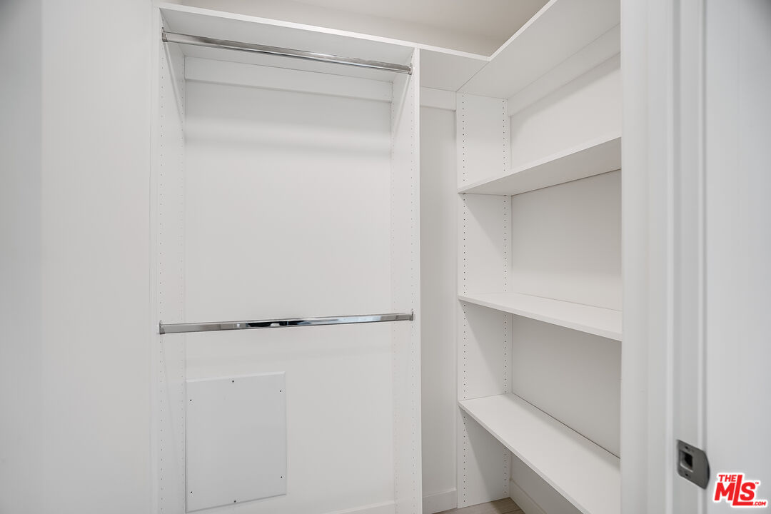 1021 South Shenandoah Street, Unit 501 Los Angeles, CA 90035 - Photo 13 of 19 a view of an empty walk in closet
