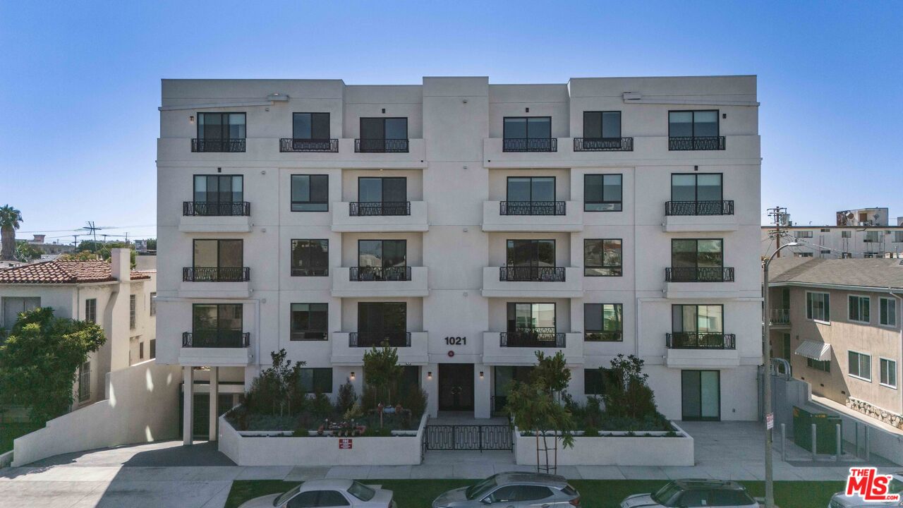 1021 South Shenandoah Street, Unit 501 Los Angeles, CA 90035 - Photo 18 of 19 a front view of a building with balcony