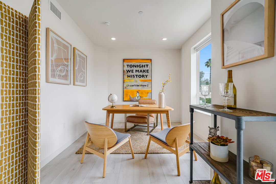 1021 South Shenandoah Street, Unit 501 Los Angeles, CA 90035 - Photo 6 of 19 a view of a workspace with furniture
