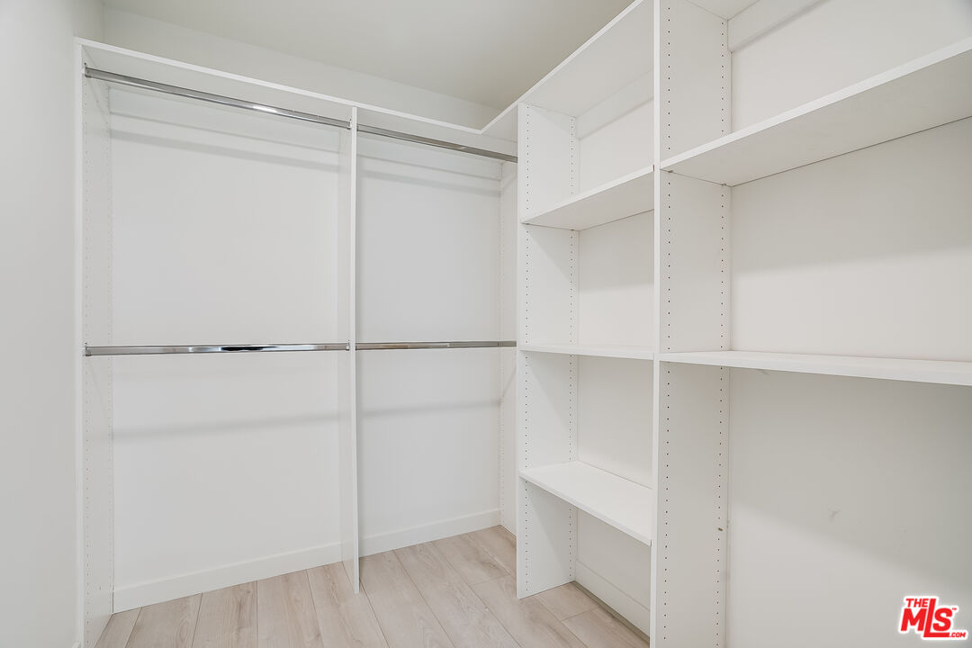 1021 South Shenandoah Street, Unit 501 Los Angeles, CA 90035 - Photo 10 of 19 a view of an empty walk in closet