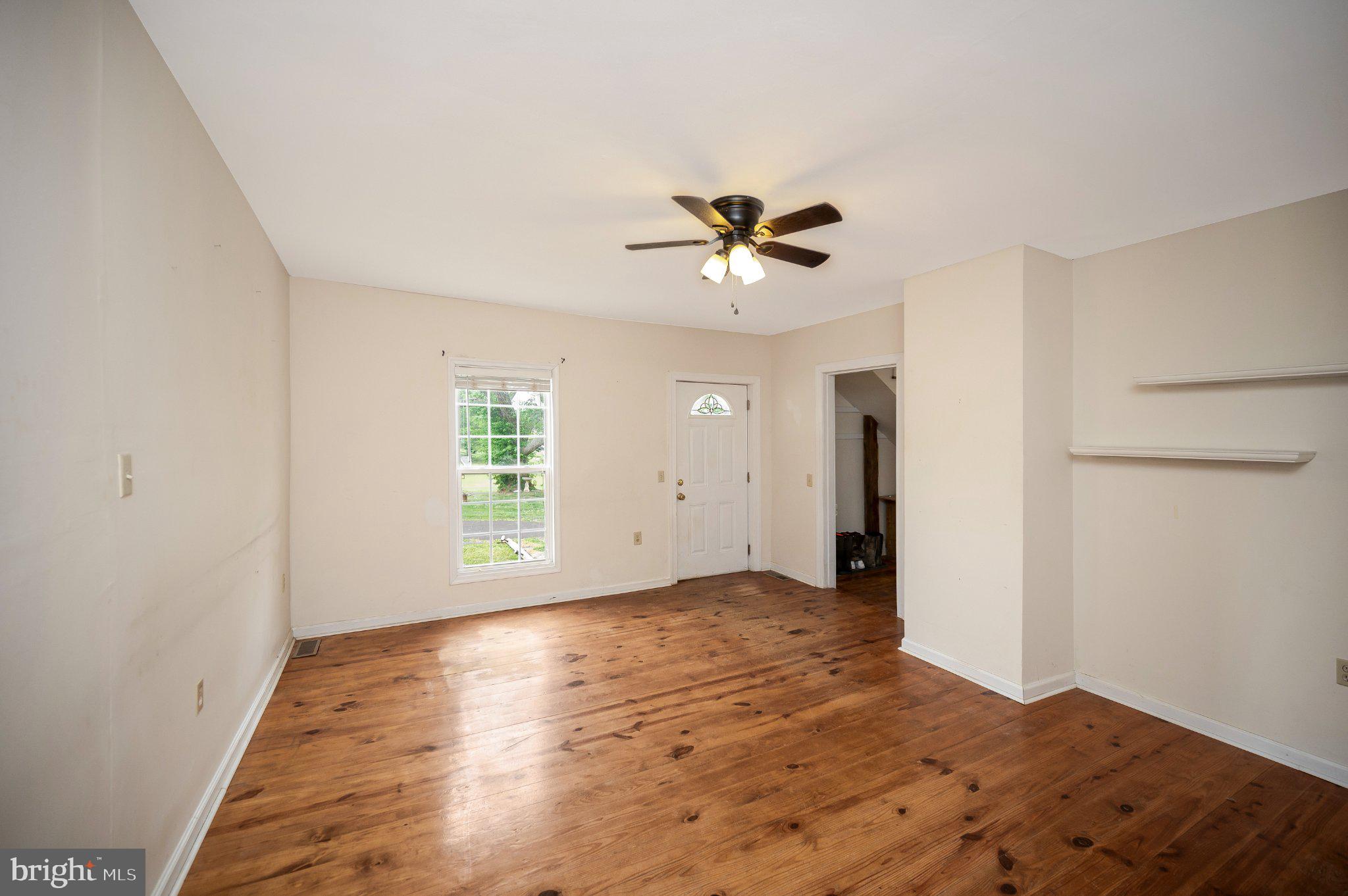 23202 Village Road Unionville, VA 22567 - Photo 16 of 58 a view of an empty room with a window