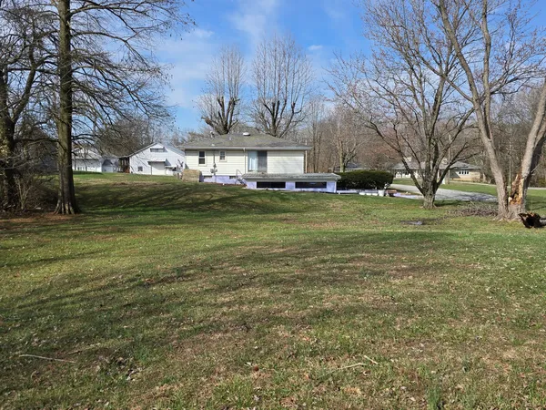 a view of a house with a yard