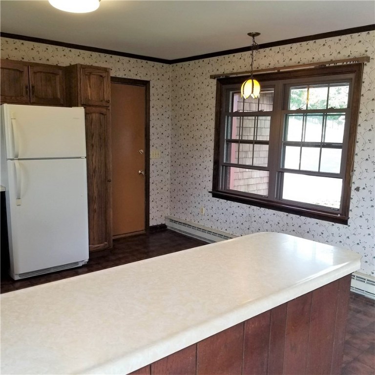 251 Taylor Road Portsmouth, RI 02871 - Photo 7 of 29 kitchen counter and door to attached garage and laundry room