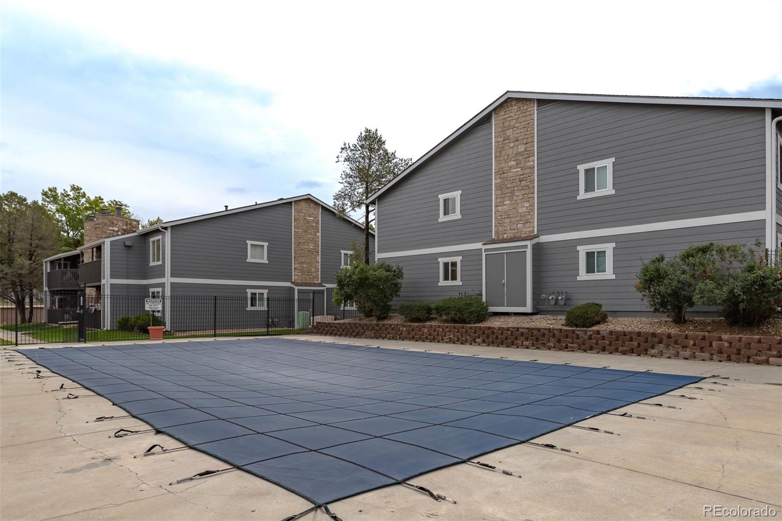 3462 South Eagle Street, Unit 201 Aurora, CO 80014 - Photo 21 of 26 a front view of a house with yard