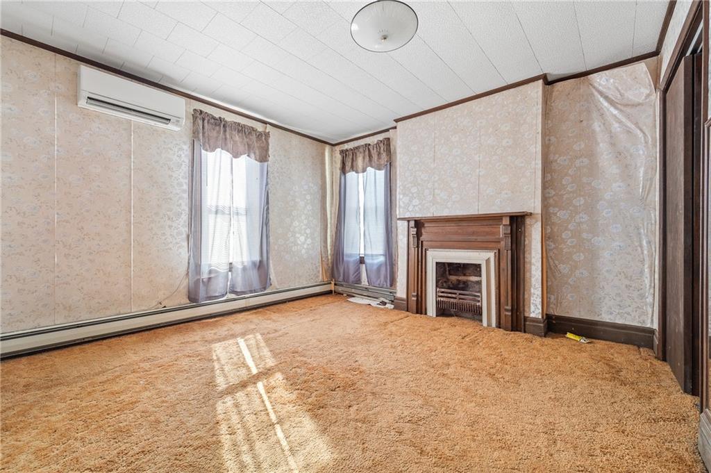 843 Pine Run Road Apollo, PA 15613 - Photo 15 of 35 a view of an empty room with a fireplace and a window
