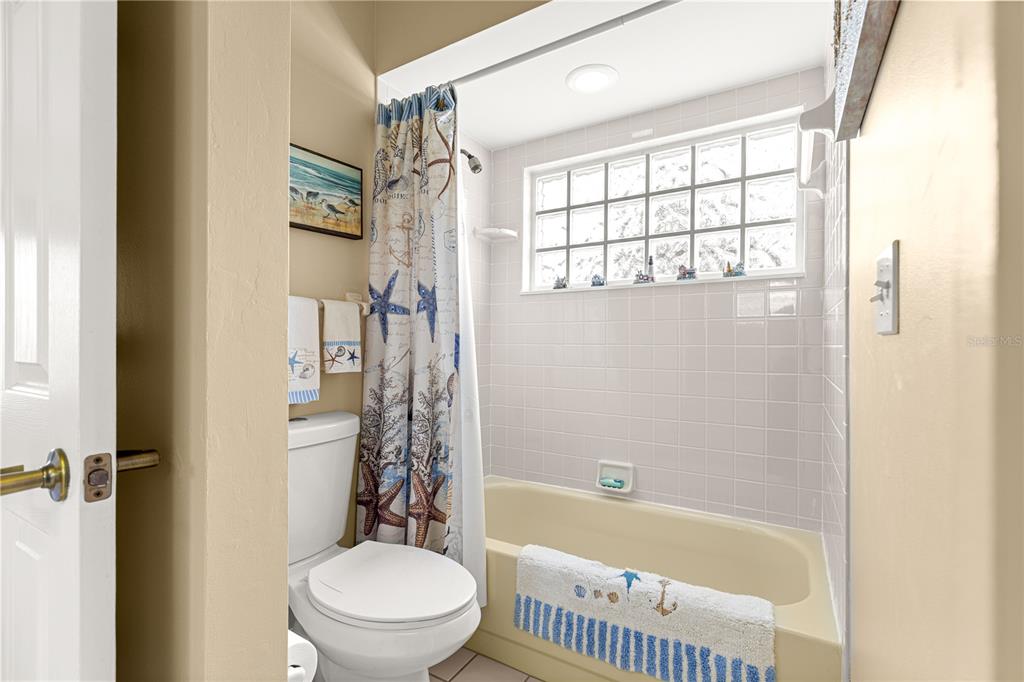 8418 Southwest 108th Pl Road Ocala, FL 34481 - Photo 23 of 80 a bathroom with a toilet and a shower