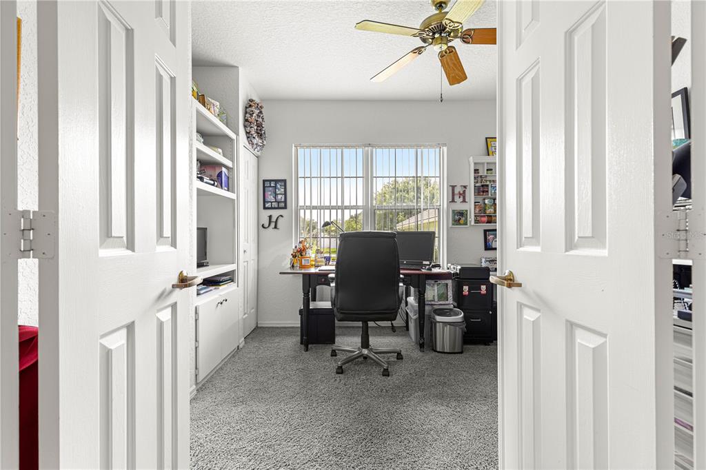 8418 Southwest 108th Pl Road Ocala, FL 34481 - Photo 25 of 80 a view of a workspace with furniture and a window