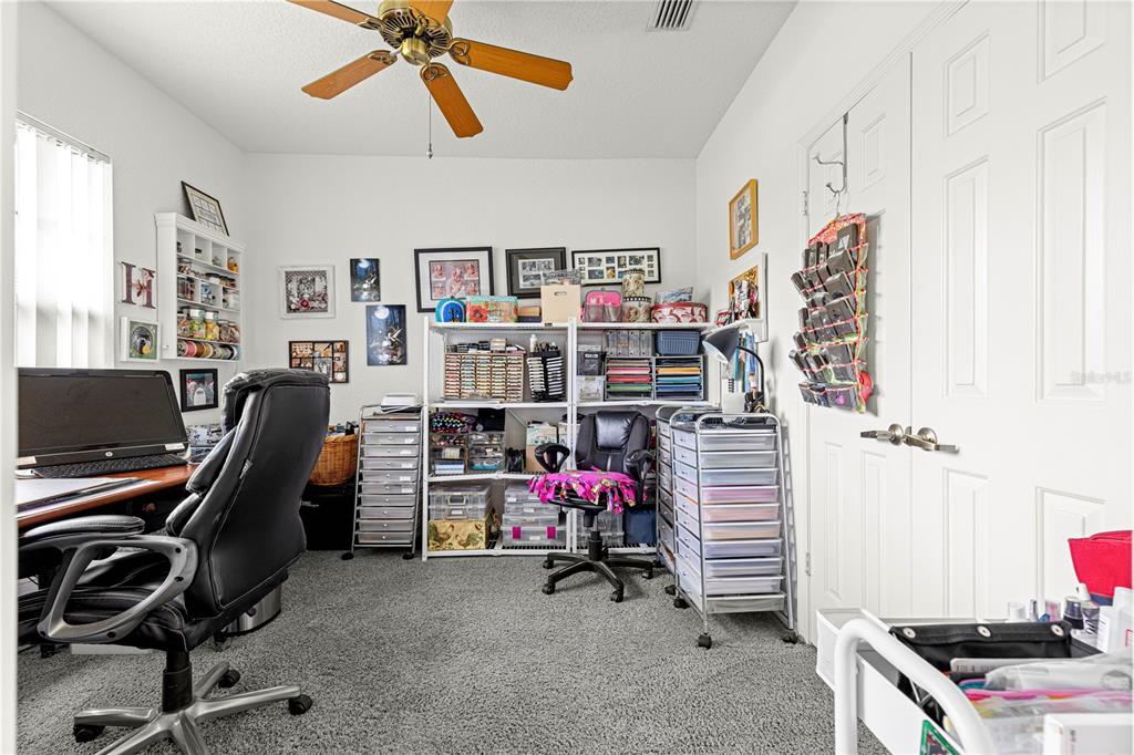 8418 Southwest 108th Pl Road Ocala, FL 34481 - Photo 26 of 80 a view of a workspace with furniture and a window