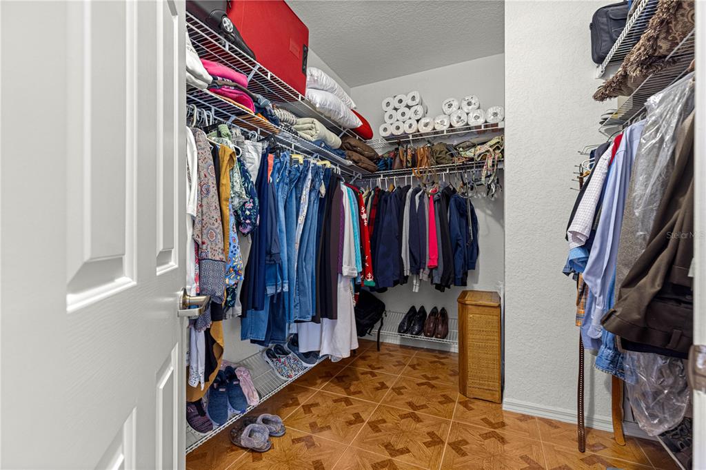 8418 Southwest 108th Pl Road Ocala, FL 34481 - Photo 31 of 80 a view of walk in closet with clothes