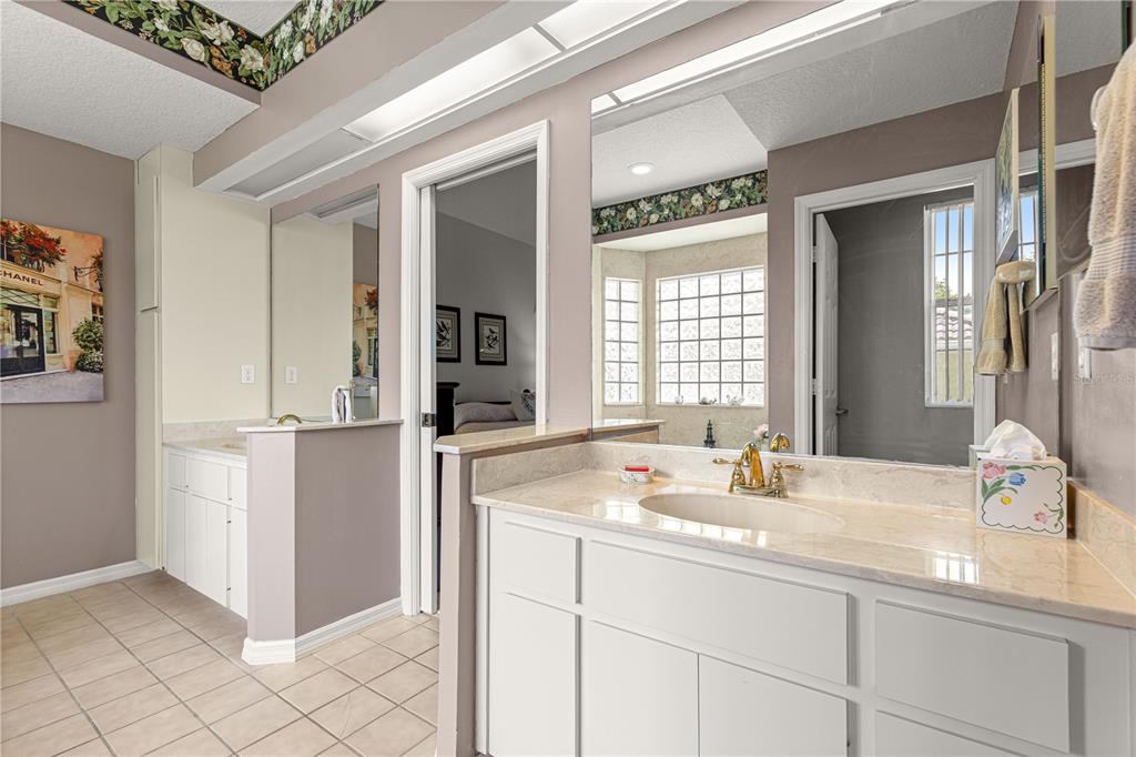 8418 Southwest 108th Pl Road Ocala, FL 34481 - Photo 35 of 80 a bathroom with a sink and a mirror