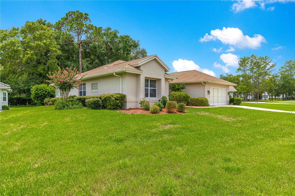 8418 Southwest 108th Pl Road Ocala, FL 34481 - Photo 48 of 80 a front view of house with yard and green space