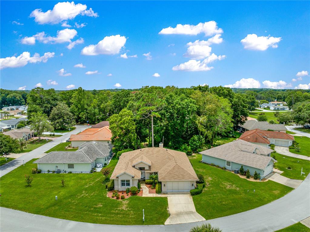 8418 Southwest 108th Pl Road Ocala, FL 34481 - Photo 56 of 80 a aerial view of a house with garden space and outdoor seating