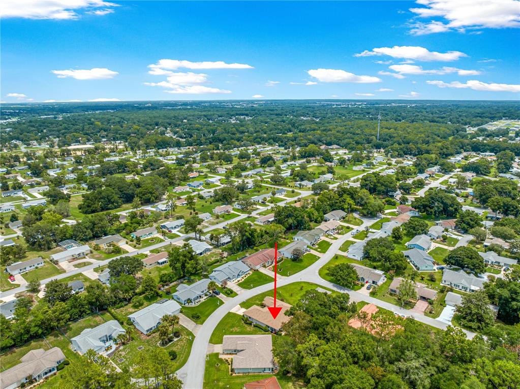 8418 Southwest 108th Pl Road Ocala, FL 34481 - Photo 60 of 80 an aerial view of residential houses with yard and outdoor space