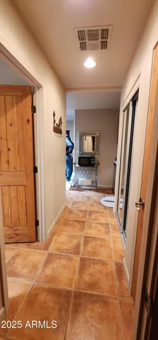 a view of kitchen with microwave and furniture