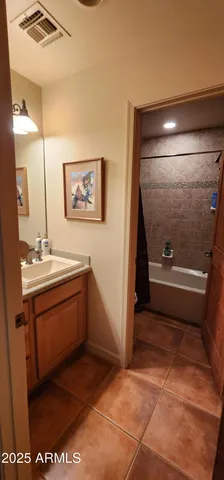 a bathroom with a sink a vanity and a mirror