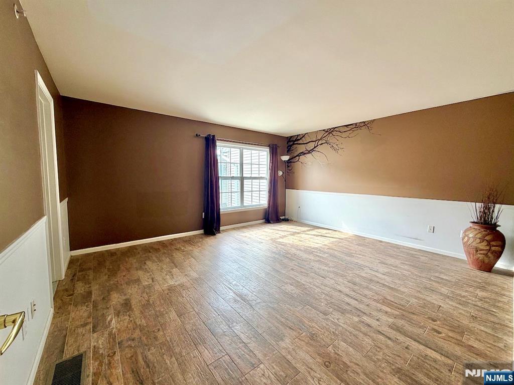 200 Dey Street, Unit 257 Harrison, NJ 07029 - Photo 11 of 21 a view of empty room with wooden floor and fan