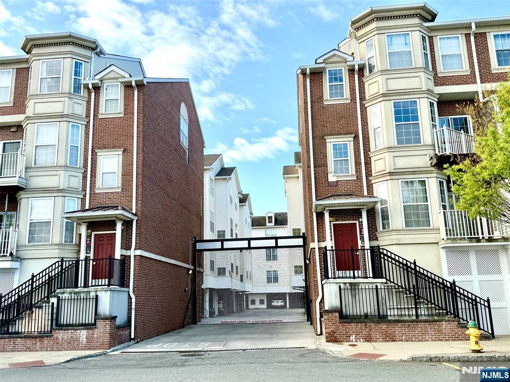 200 Dey Street, Unit 257 Harrison, NJ 07029 - Photo 13 of 21 a front view of a building with many windows