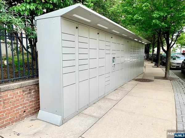 a view of a a dining room with furniture window and wooden floor