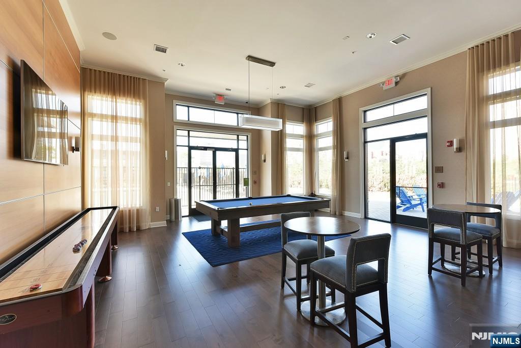 200 Dey Street, Unit 257 Harrison, NJ 07029 - Photo 16 of 21 a view of a a dining room with furniture window and wooden floor
