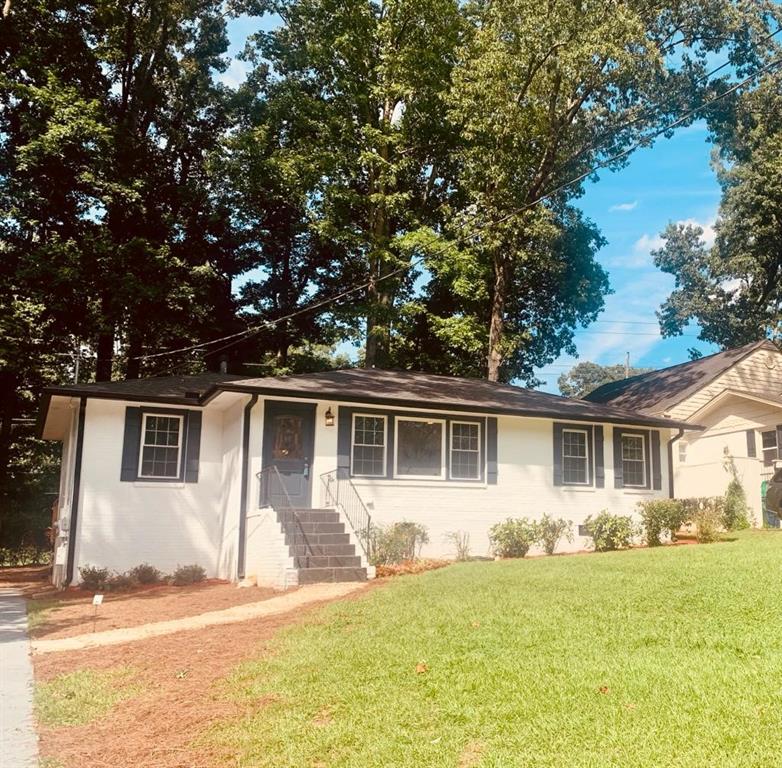 824 Larry Lane Decatur, GA 30033 - Photo 1 of 1 a front view of house with yard and trees around