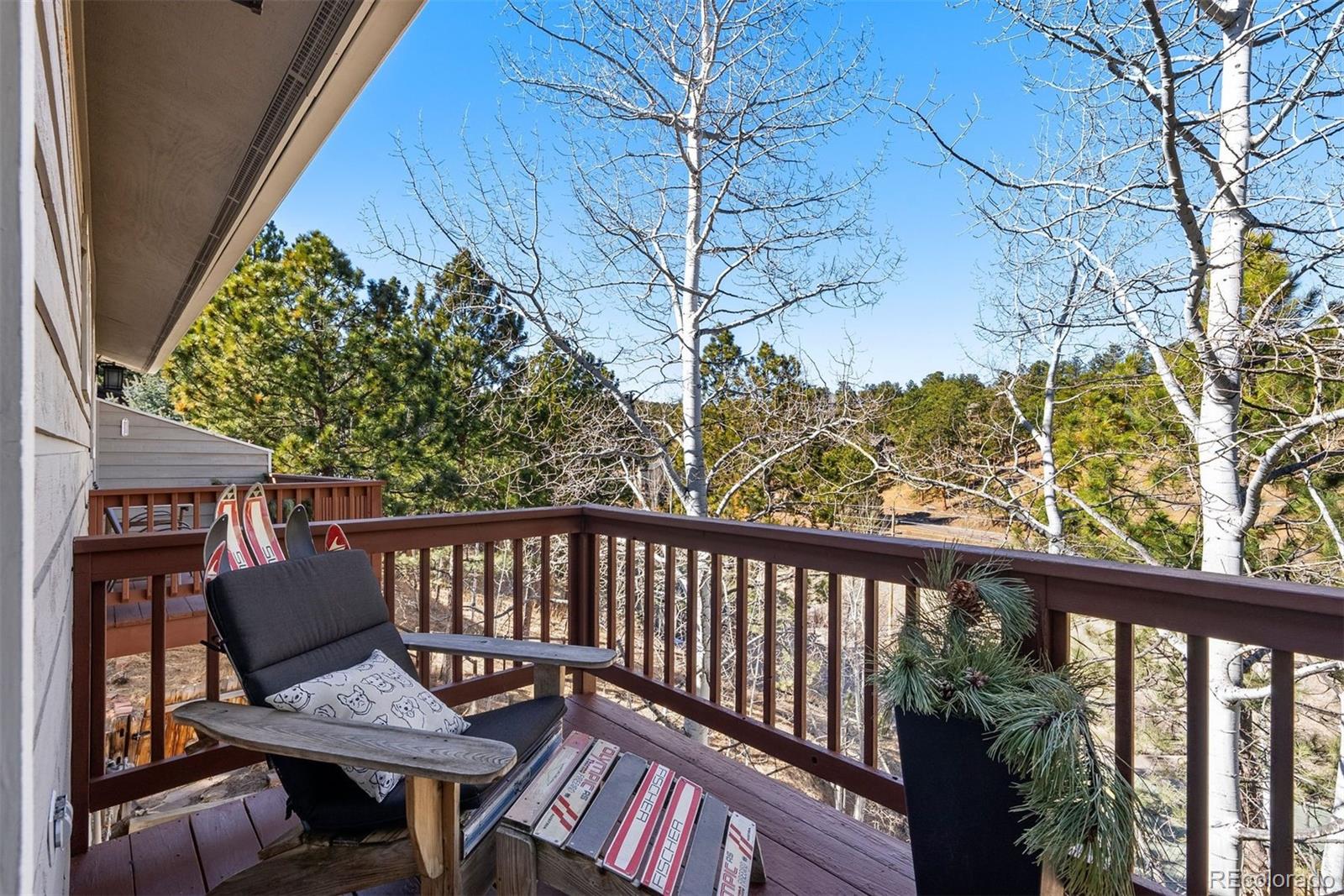 29895 Spruce Road Evergreen, CO 80439 - Photo 23 of 38 a view of a balcony with furniture