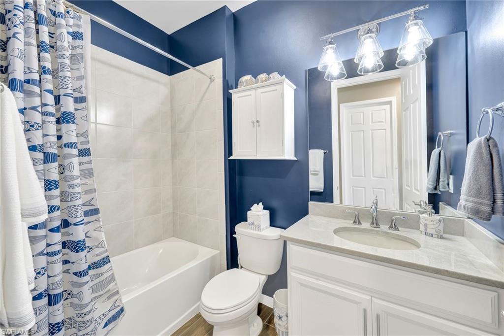 1261 Enbrook Loop Naples, FL 34114 - Photo 13 of 23 a bathroom with a sink toilet and shower