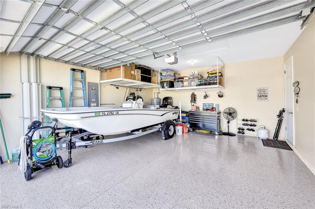 1261 Enbrook Loop Naples, FL 34114 - Photo 16 of 23 a living room with furniture and a table