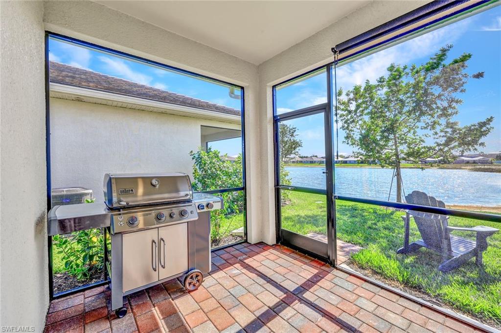 1261 Enbrook Loop Naples, FL 34114 - Photo 17 of 23 a view of a porch and garden