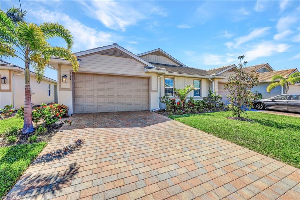 1261 Enbrook Loop Naples, FL 34114 - Photo 2 of 23 a front view of house with yard