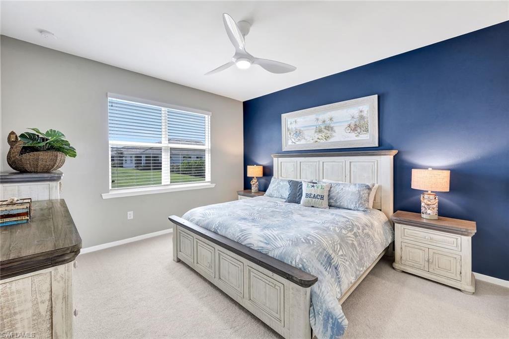 1261 Enbrook Loop Naples, FL 34114 - Photo 10 of 23 a bedroom with a bed and a dresser next to a window